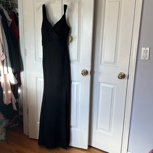 Windsor black long gown form fitting with high slit in a size small